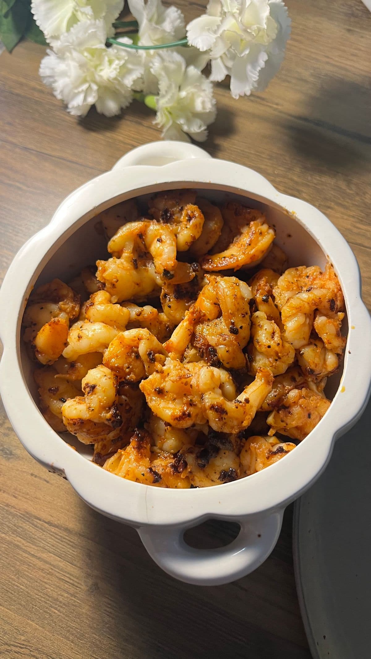 A bowl of butter-garlic prawns.