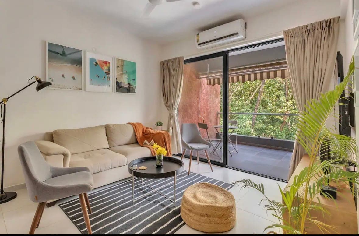 The living area, opening to the balcony.