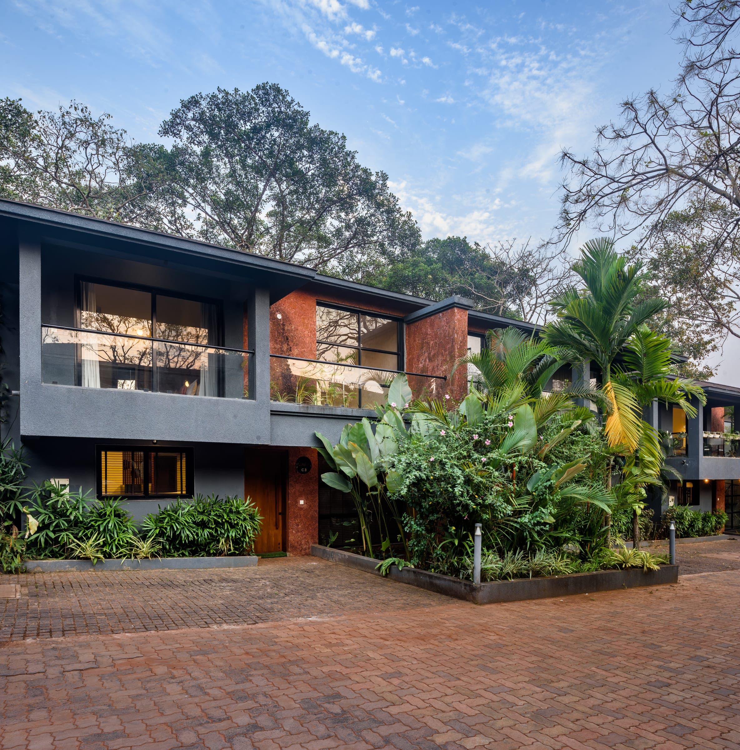 An exterior view of a Nistula villa and its garden.